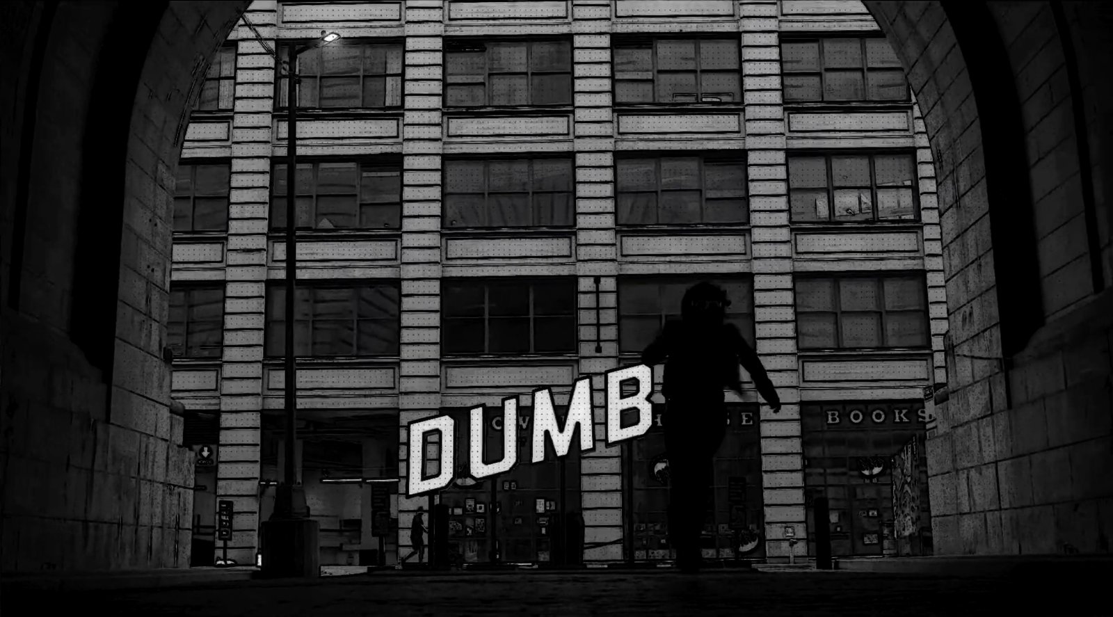 A silhouetted figure walking under the Manhattan Bridge archway in Dumbo, Brooklyn